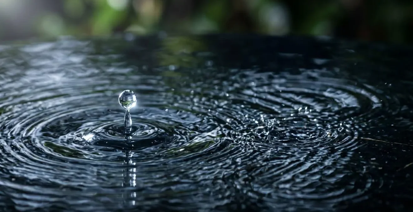 Macro close-up of water droplets creating ripple patterns and sound frequencies that mask urban noise pollution